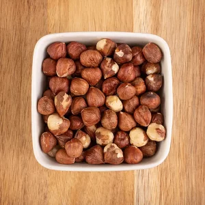 raw hazelnuts with flakes
